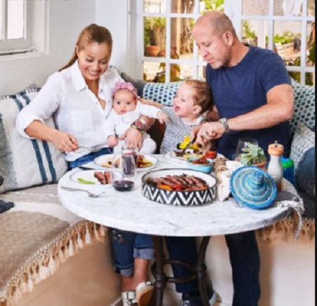 Marcela Valladolid and Philip Button with their children