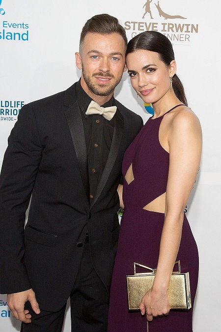 Torrey DeVitto and Artem Chigvintsev in an event
