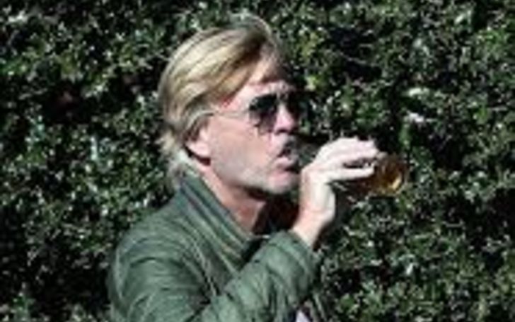 Richard Madeley drinks a Corona beer As He Goes on a Walk in The Sunshine